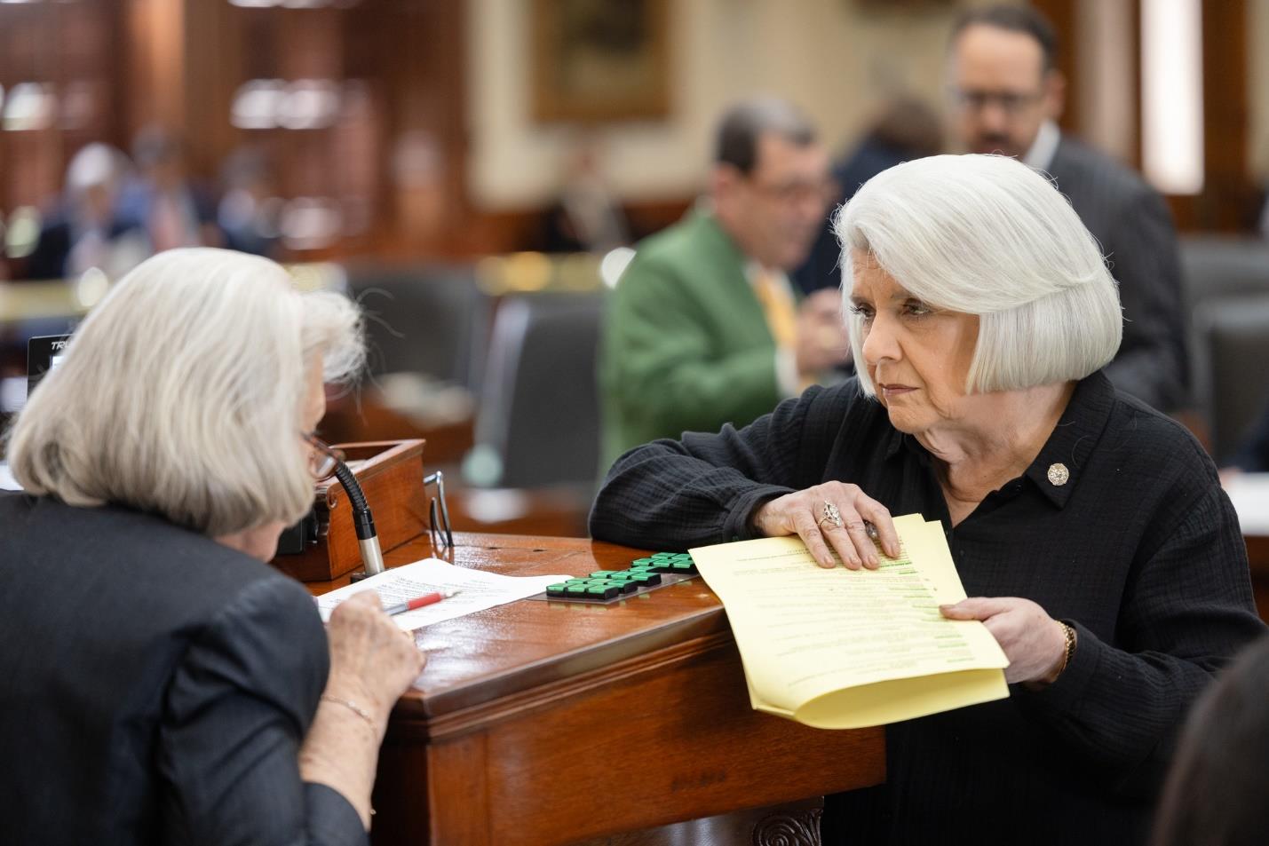 Photo: Dean Senator Judith Zaffirini prepares to present legislation in the Senate chamber during the 89th Regular Session of the Texas Legislature.